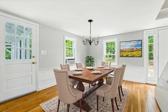 a living room with large windows and furniture