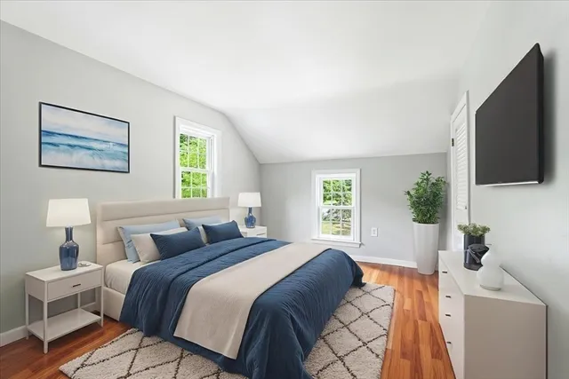 a bedroom with a bed and a dresser