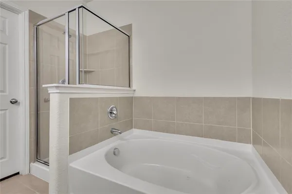 a bathroom with a sink a toilet a shower and a mirror