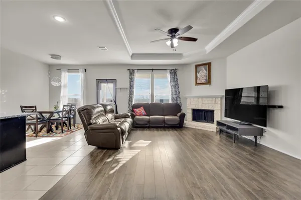 a living room with furniture and a fireplace