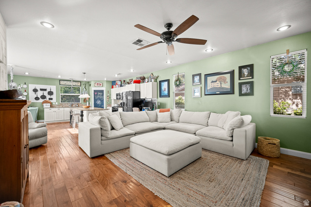 236 West 300 South Hurricane, UT 84737 - Photo 16 of 76 Open-concept living area featuring wood-finish flooring, a ceiling fan with light, recessed lighting, and multiple windows