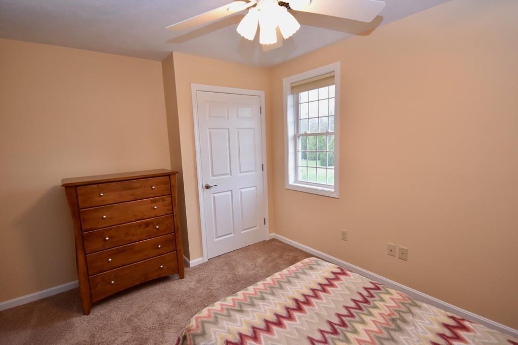 152 Plumtree Road Sunderland, MA 01375 - Photo 24 of 34 a bedroom with a bed and a dresser