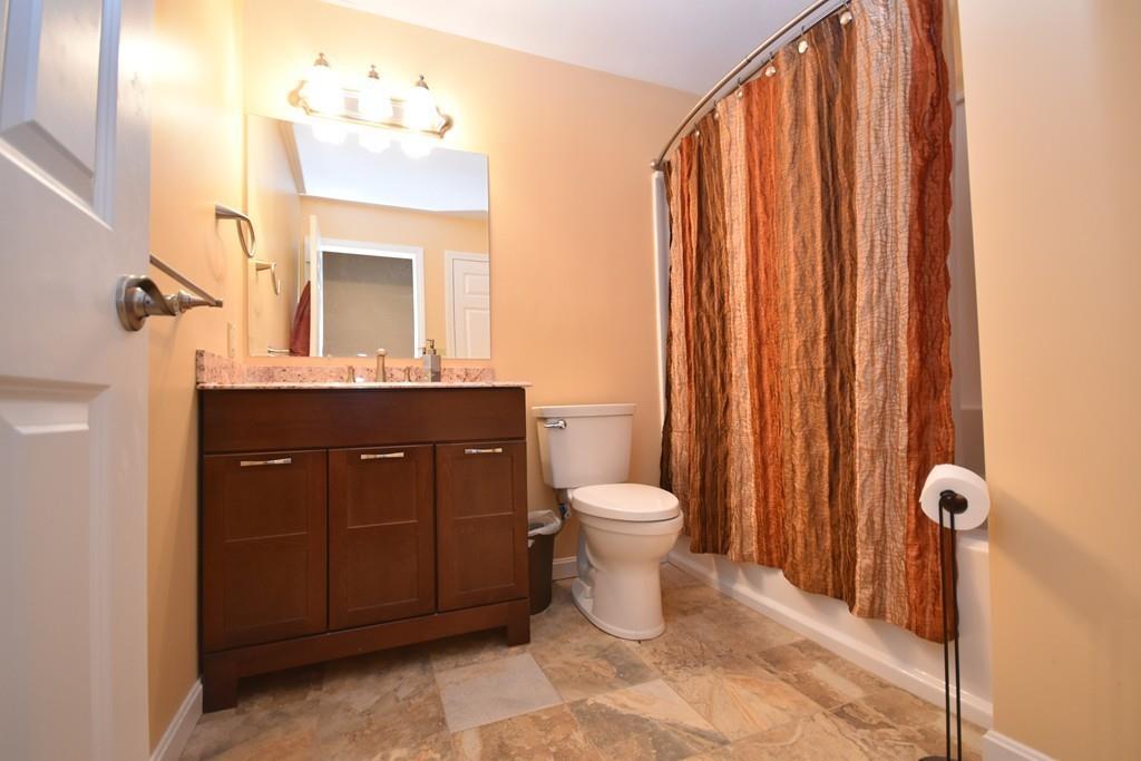 152 Plumtree Road Sunderland, MA 01375 - Photo 27 of 34 a bathroom with a toilet a sink and mirror
