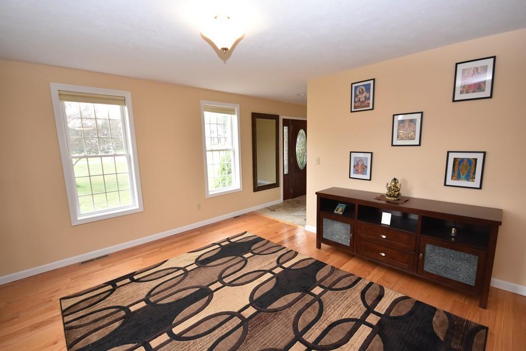 152 Plumtree Road Sunderland, MA 01375 - Photo 4 of 34 a bedroom with a bed and wooden floor