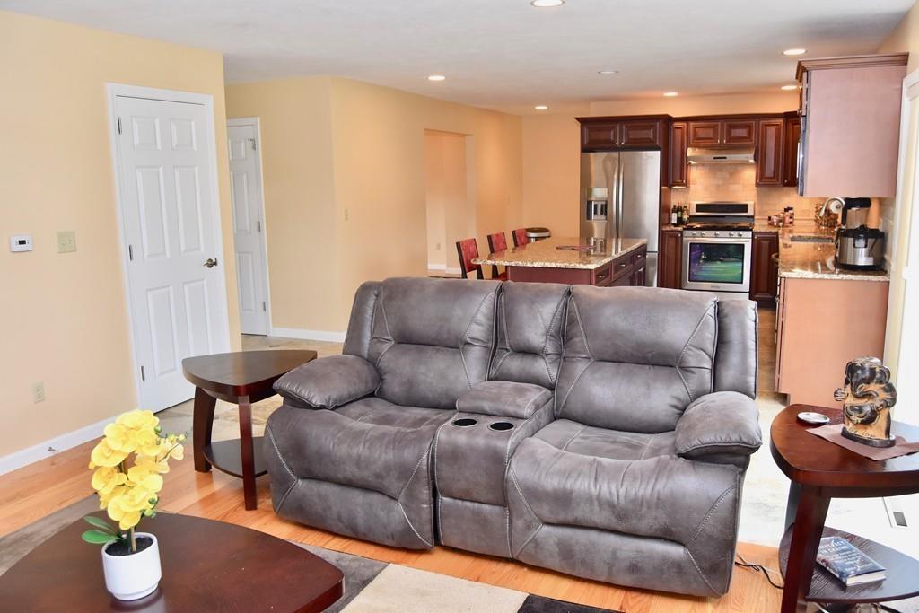 152 Plumtree Road Sunderland, MA 01375 - Photo 10 of 34 a living room with furniture kitchen and a window