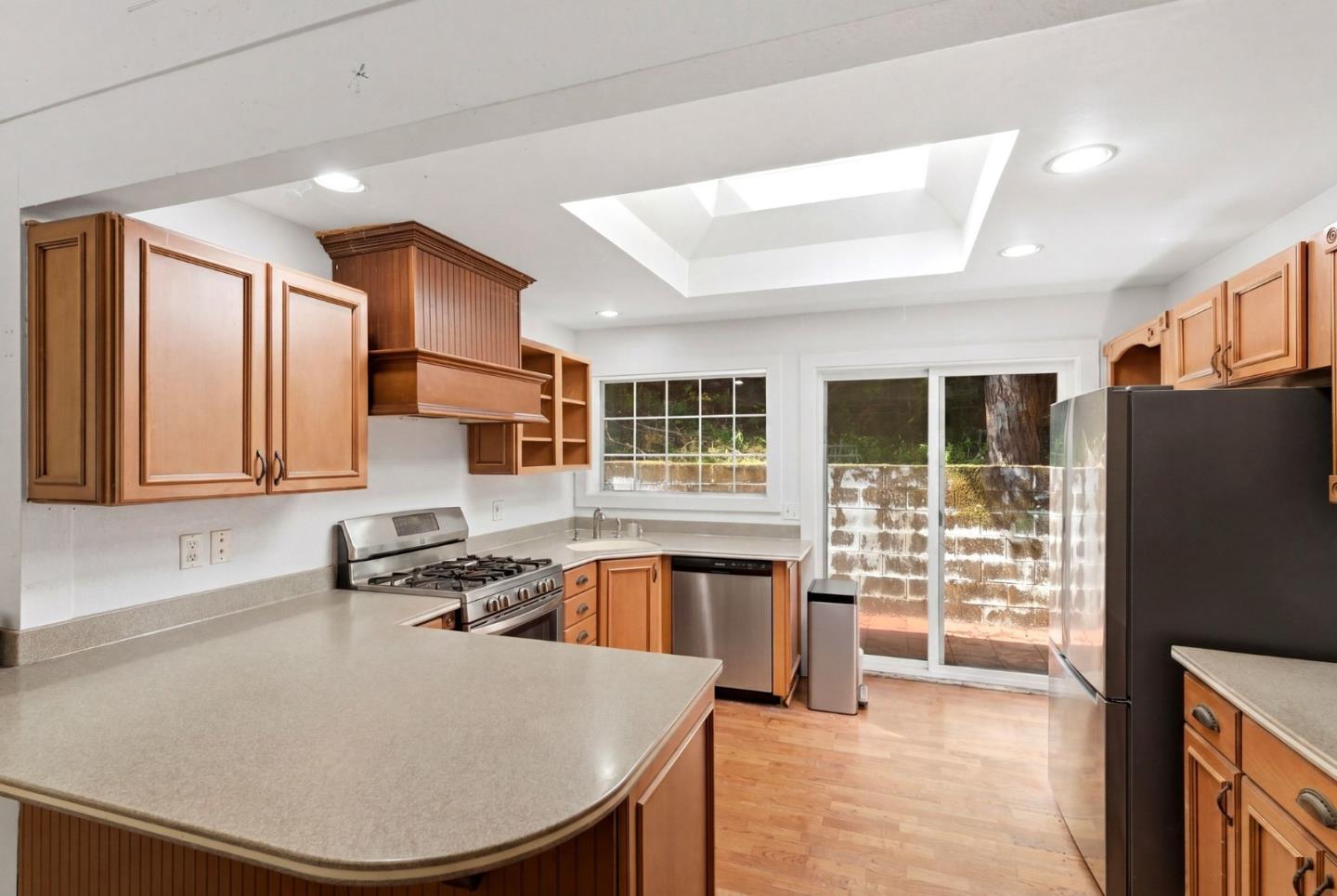 1460 Tucker Road Scotts Valley, CA 95066 - Photo 5 of 32 a kitchen with stainless steel appliances granite countertop a sink stove and refrigerator