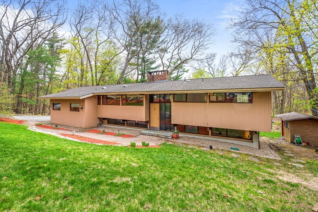65 Spring Grove Road Andover, MA 01810 - Photo 1 of 41 front view of a house with a yard