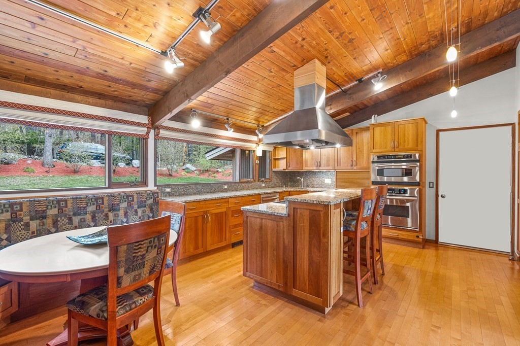 65 Spring Grove Road Andover, MA 01810 - Photo 14 of 41 a dining hall with stainless steel appliances granite countertop a sink and cabinets