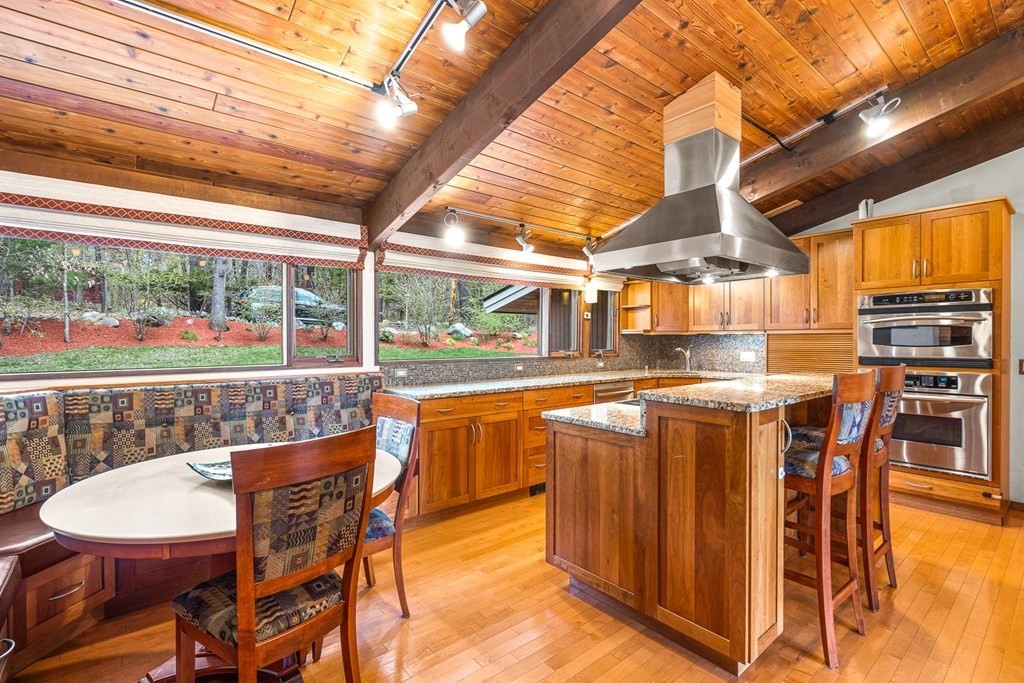 65 Spring Grove Road Andover, MA 01810 - Photo 15 of 41 a view of a dining room with furniture window and outside view