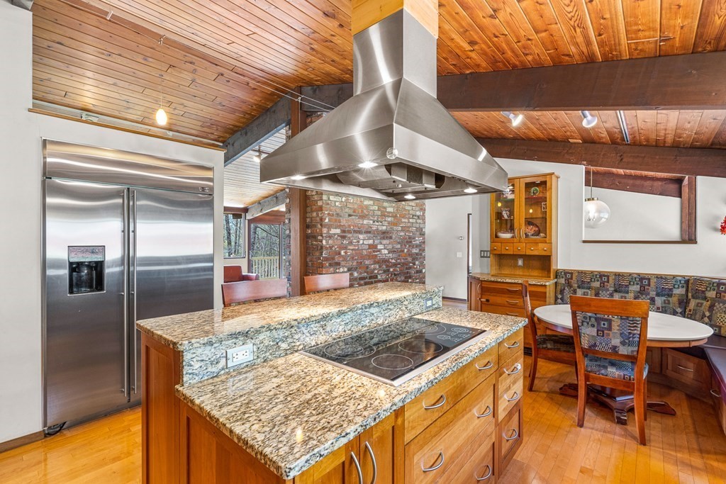 65 Spring Grove Road Andover, MA 01810 - Photo 20 of 41 a kitchen with stainless steel appliances granite countertop a sink and a refrigerator