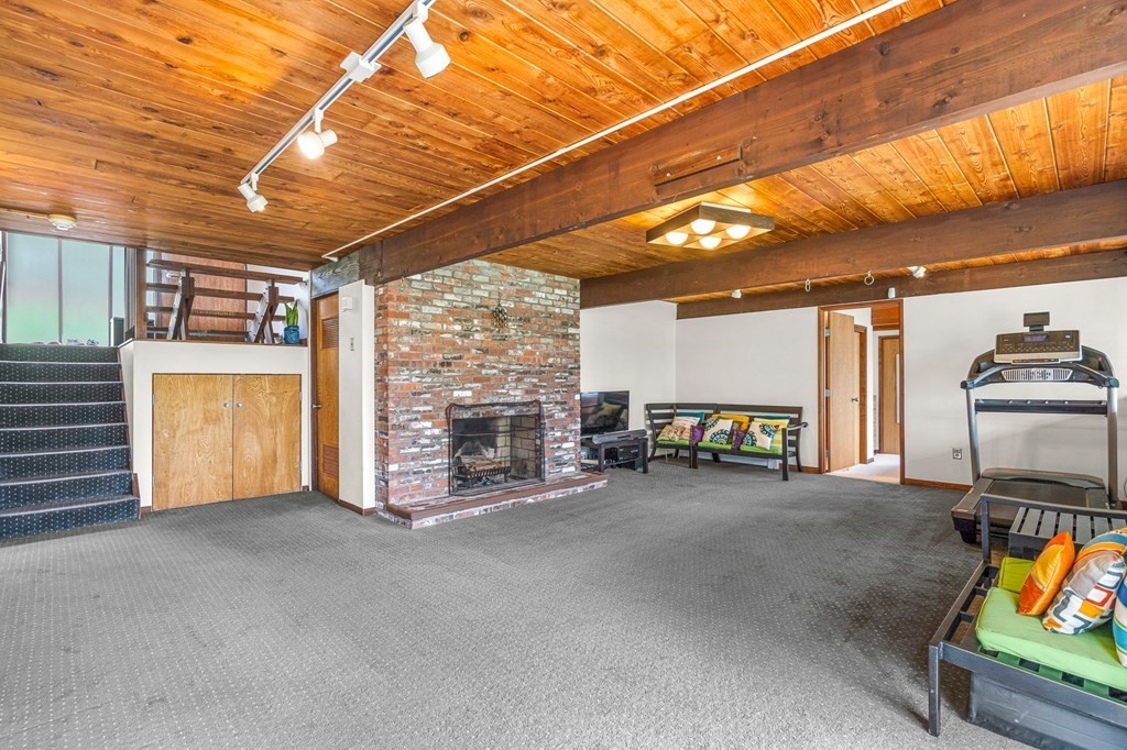 65 Spring Grove Road Andover, MA 01810 - Photo 35 of 41 a view of a livingroom with furniture and a garage