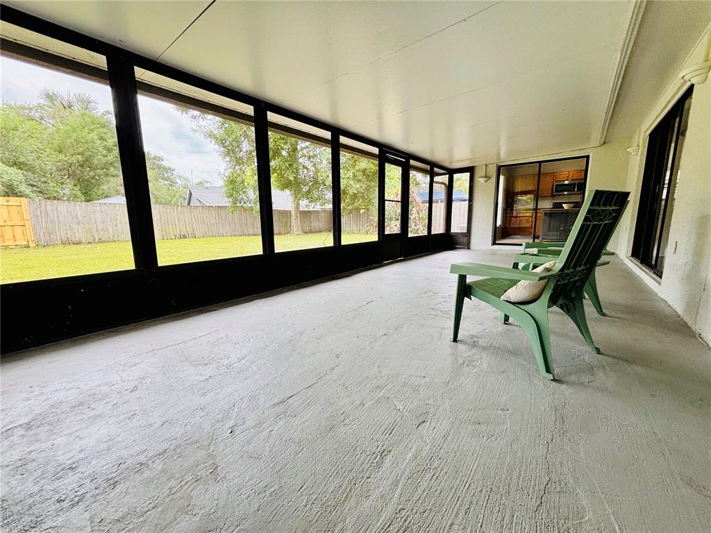 1045 Shaffer Trail Oviedo, FL 32765 - Photo 20 of 30 a view of an empty room with furniture and a large window