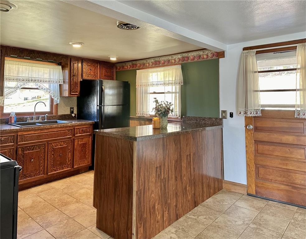 1281 Old State Road Apollo, PA 15613 - Photo 11 of 29 a kitchen with granite countertop wooden cabinets and stainless steel appliances