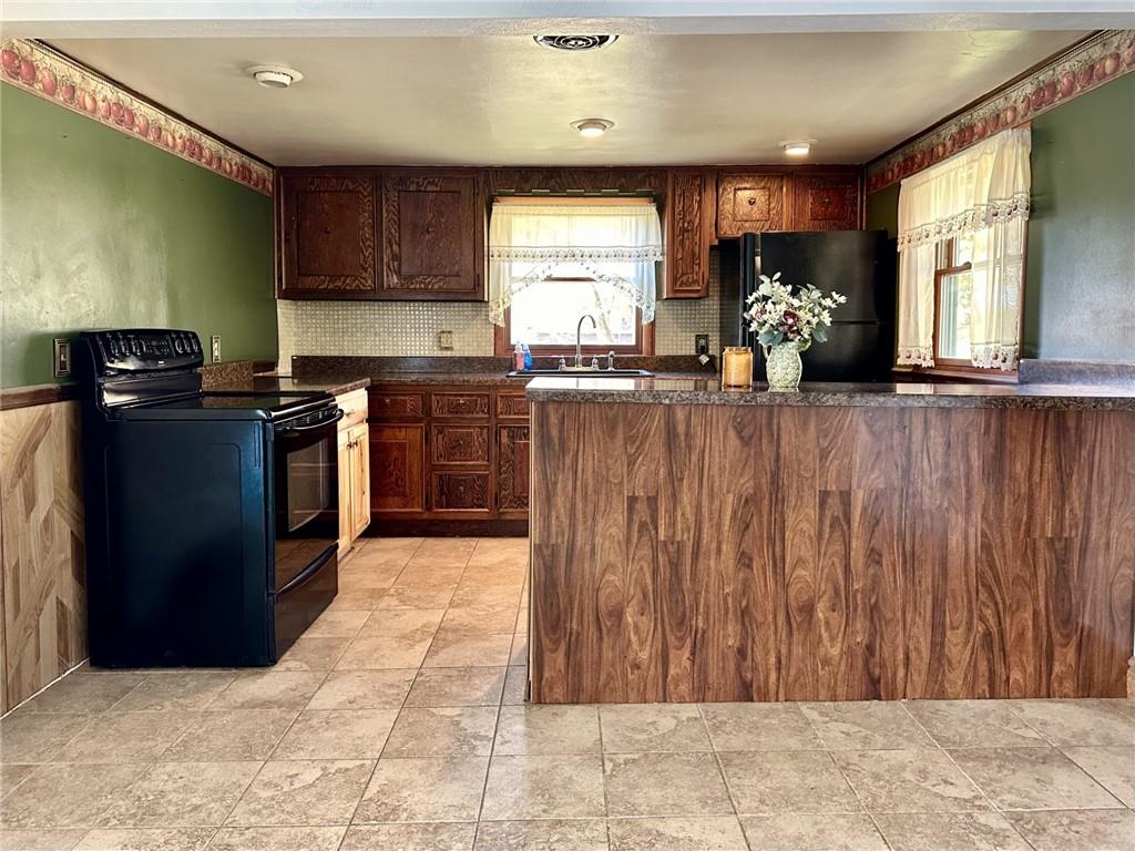 1281 Old State Road Apollo, PA 15613 - Photo 12 of 29 a kitchen with stainless steel appliances granite countertop a refrigerator and a stove