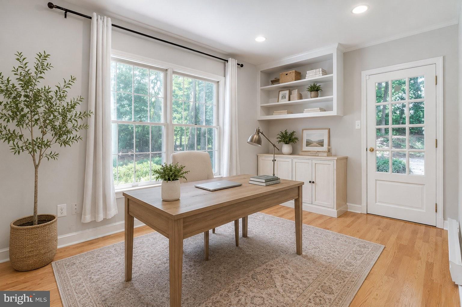8500 Brook Road McLean, VA 22102 - Photo 24 of 59 a view of a workspace with furniture and a potted plant