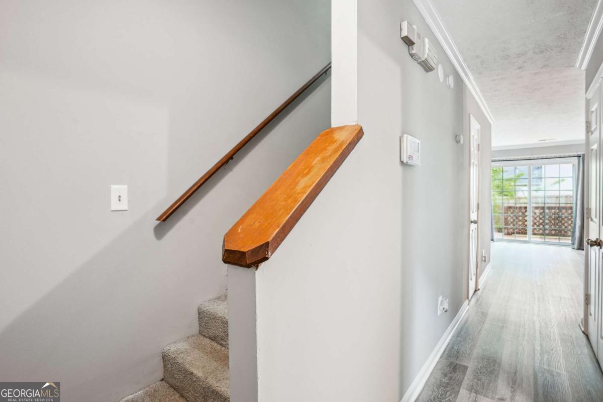 2049 Charter Lane Lithonia, GA 30058 - Photo 15 of 25 a view of entryway and kitchen with wooden floor