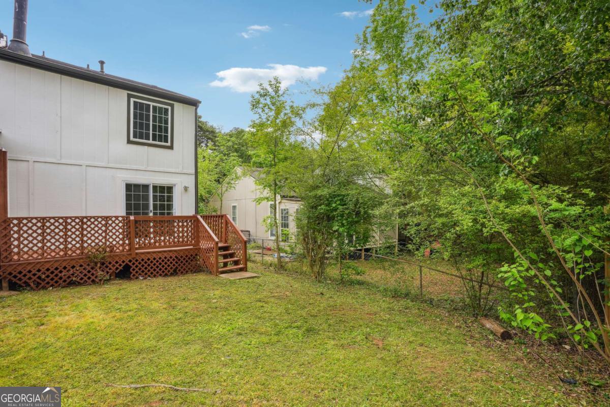 2049 Charter Lane Lithonia, GA 30058 - Photo 23 of 25 a view of a backyard with a garden and entertaining space