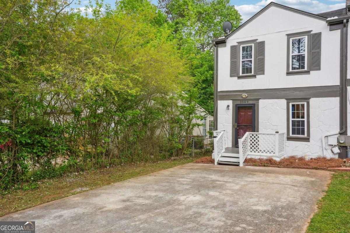 2049 Charter Lane Lithonia, GA 30058 - Photo 3 of 25 a view of a house with backyard and sitting area