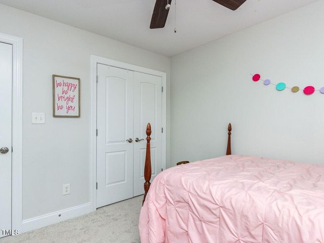 a bedroom with a bed and cabinets