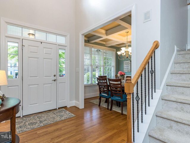 a dining room with furniture and entryway