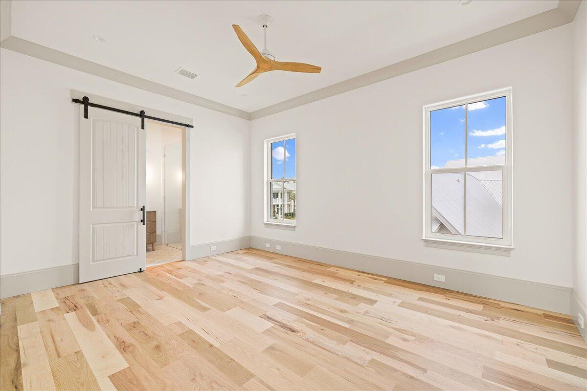 92 Quail Hollow Inlet Beach, FL 32461 - Photo 55 of 119 a view of empty room with wooden floor and fan
