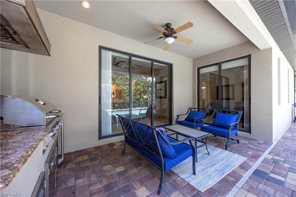 9234 Veneto Place Naples, FL 34113 - Photo 28 of 38 a living room with furniture and a window
