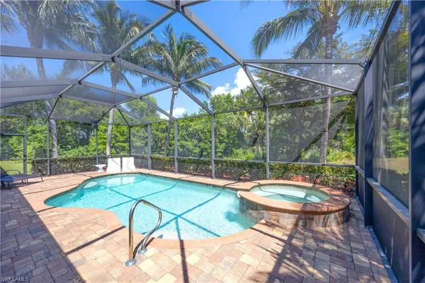 a view of a swimming pool with a patio