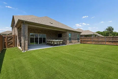 a view of a backyard with a garden