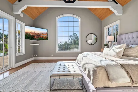 a spacious bathroom with a double vanity sink a mirror and a bathtub