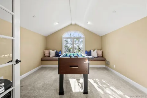 a room with furniture a window and a chandelier
