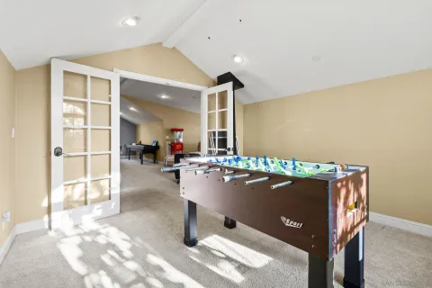 a bathroom with a granite countertop sink a toilet a mirror and shower