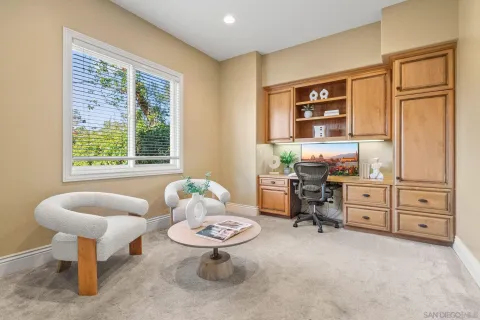 a spacious bedroom with a bed and a desk