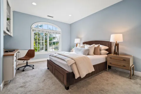 a bedroom with a workspace