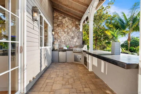 a kitchen with a table chairs refrigerator and cabinets