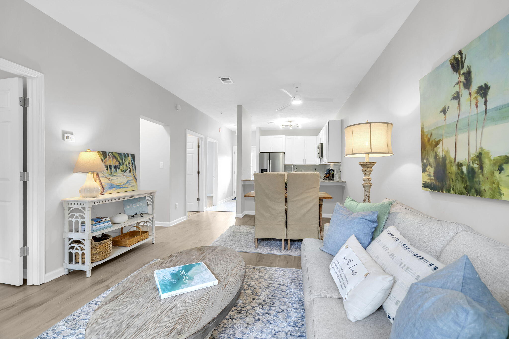 34 Heron's Watch Way, Unit 1202 Santa Rosa Beach, FL 32459 - Photo 11 of 36 a living room with furniture and a wooden floor