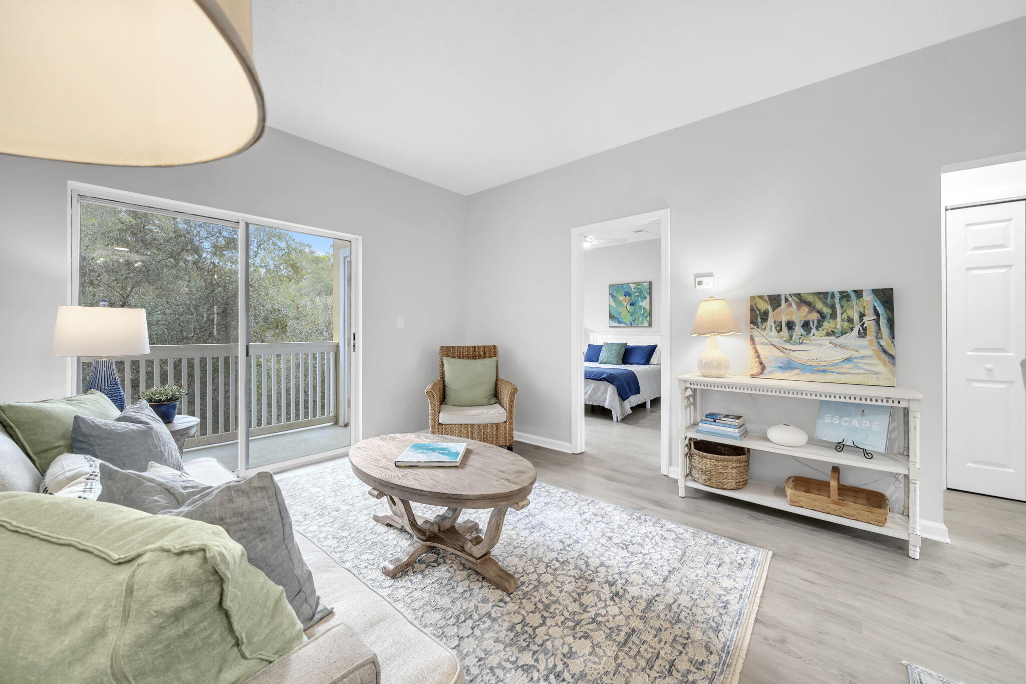 34 Heron's Watch Way, Unit 1202 Santa Rosa Beach, FL 32459 - Photo 16 of 36 a living room with furniture a rug and a floor to ceiling window