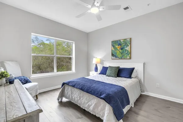a bedroom with a bed and a large window with outer space
