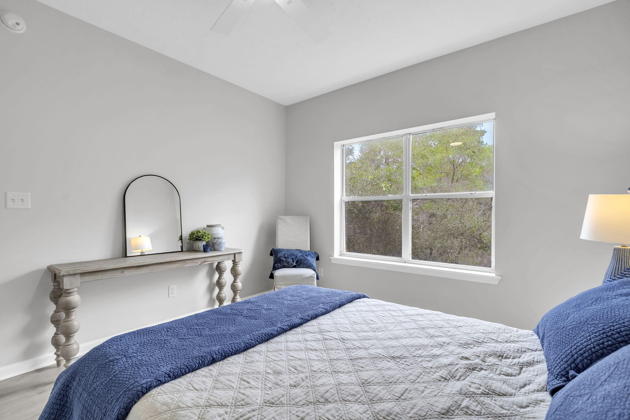 34 Heron's Watch Way, Unit 1202 Santa Rosa Beach, FL 32459 - Photo 19 of 36 a bedroom with a bed and a large window with outer space
