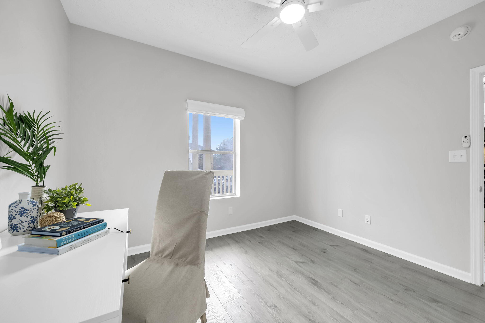 34 Heron's Watch Way, Unit 1202 Santa Rosa Beach, FL 32459 - Photo 23 of 36 a view of a workspace with furniture and wooden floor