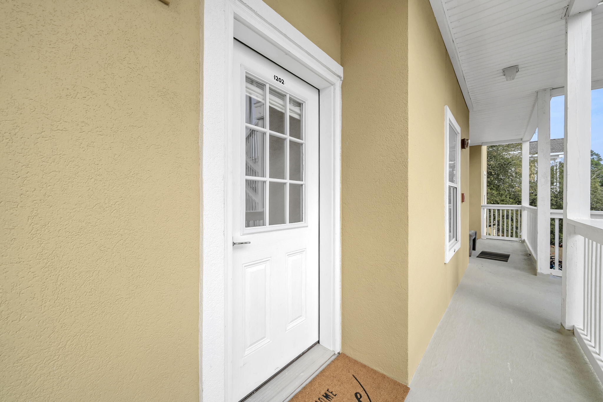 34 Heron's Watch Way, Unit 1202 Santa Rosa Beach, FL 32459 - Photo 36 of 36 a view of a hallway with wooden floor and entryway