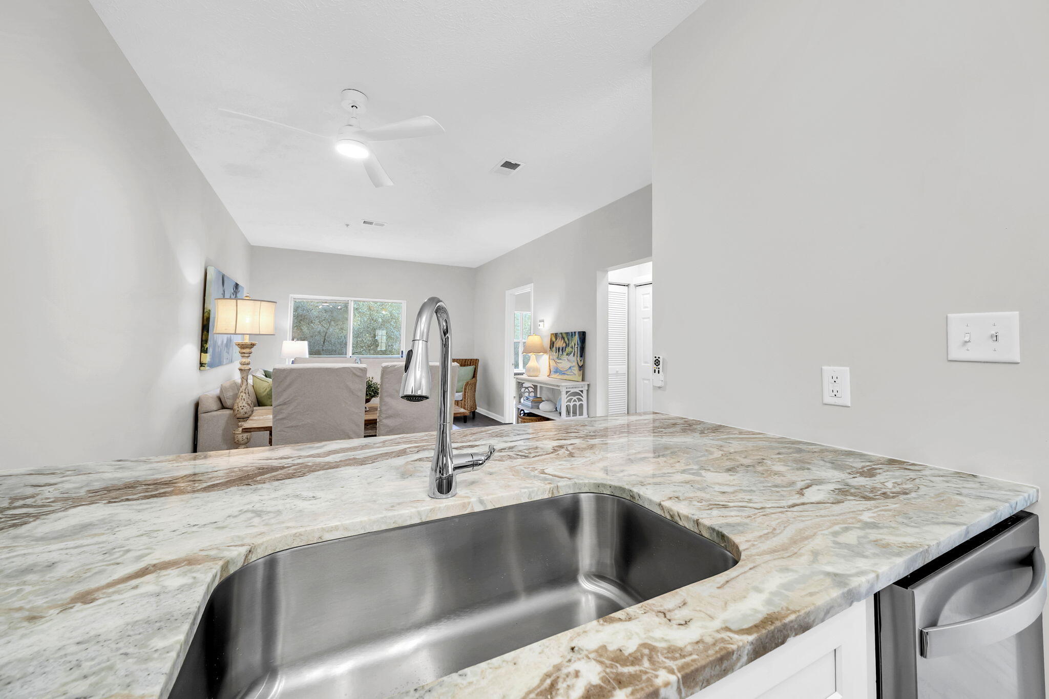 34 Heron's Watch Way, Unit 1202 Santa Rosa Beach, FL 32459 - Photo 7 of 36 a kitchen with a sink and a refrigerator