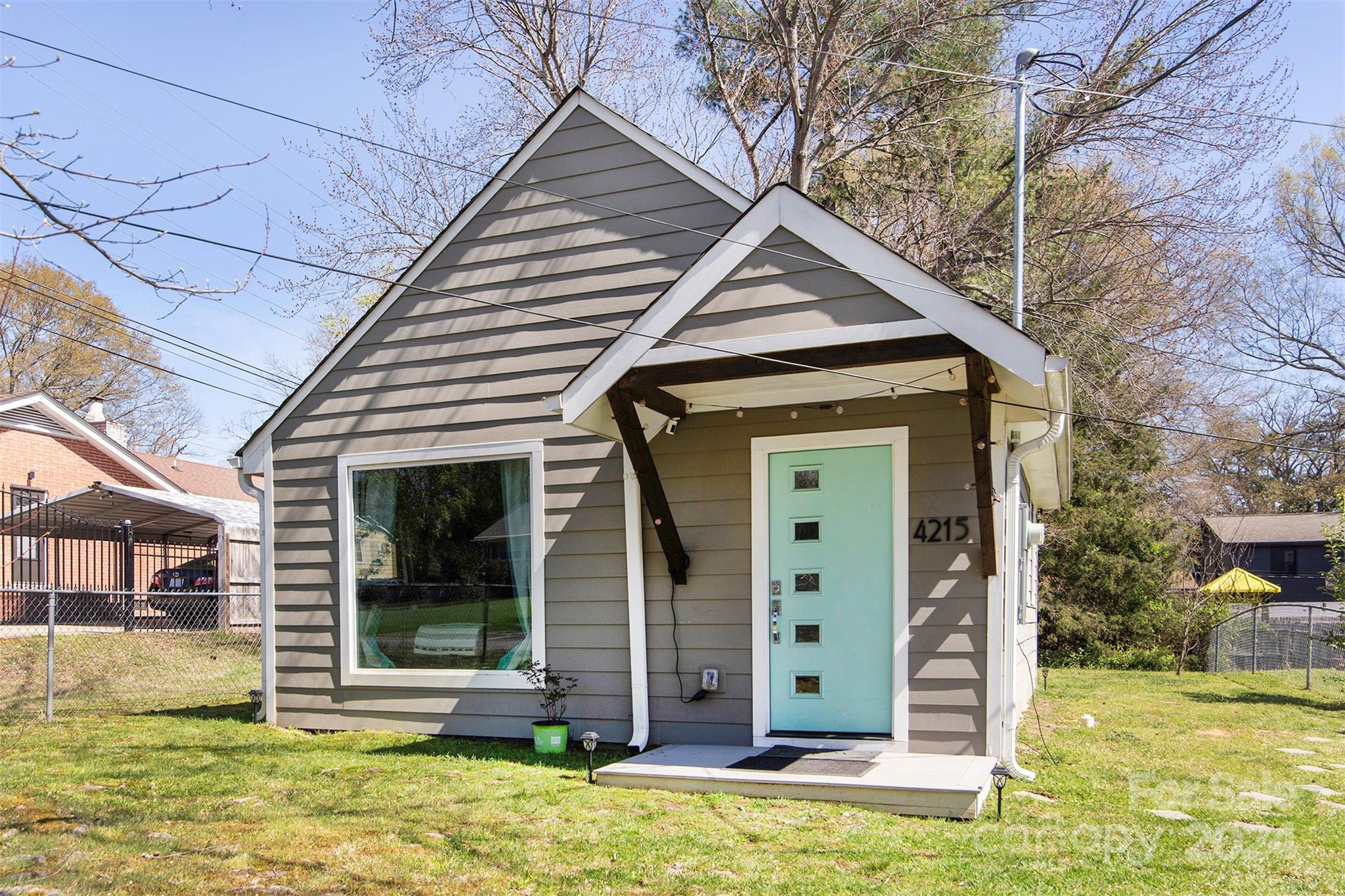3741 Woodleaf Road Charlotte, NC 28205 - Photo 19 of 31 a view of a small house with backyard