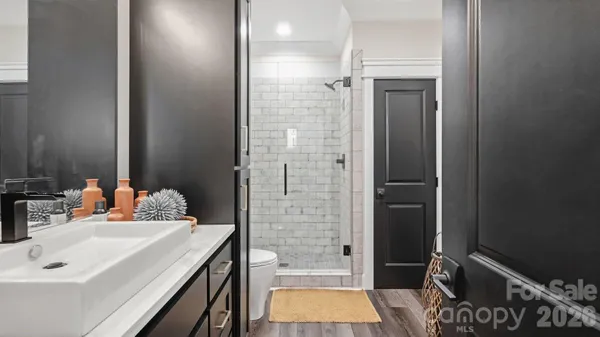 a bathroom with a sink vanity and a mirror
