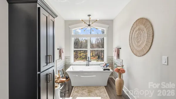 a bathroom with a glass shower door and a sink