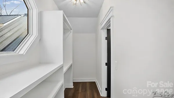 a view of an empty walk in closet