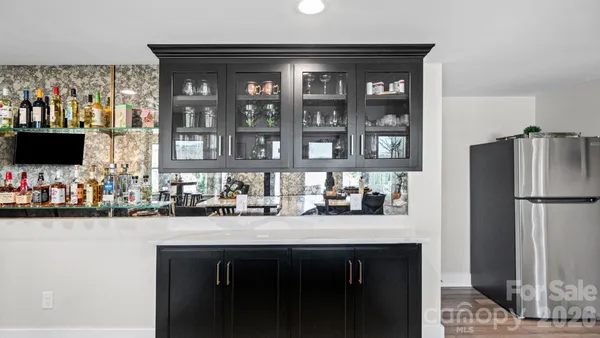 a bathroom with a sink vanity and mirror