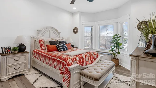 a living room with furniture and large windows