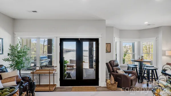 a room with furniture a flat screen tv and a faucet