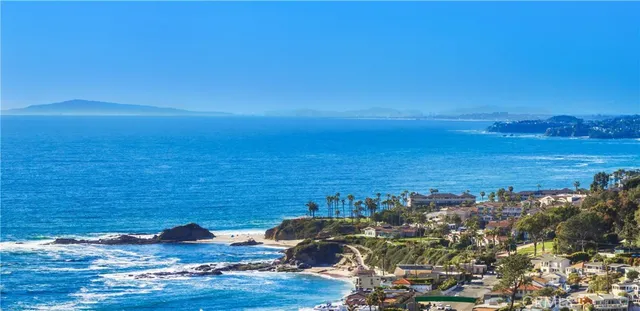 a view of a entryway door of the room and wooden floor