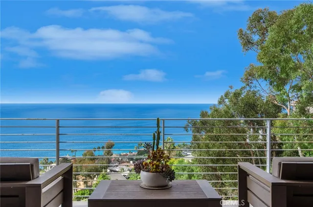 a view of a balcony with chair and potted plant